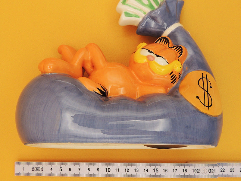 Garfield - Tirelire Sac de Billets - Céramique Tropico Diffusion